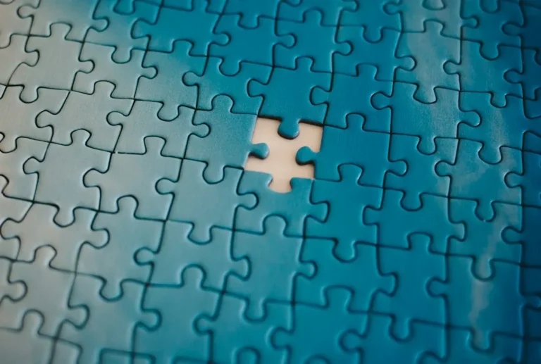 Puzzle pieces fitting together, representing relationship compatibility