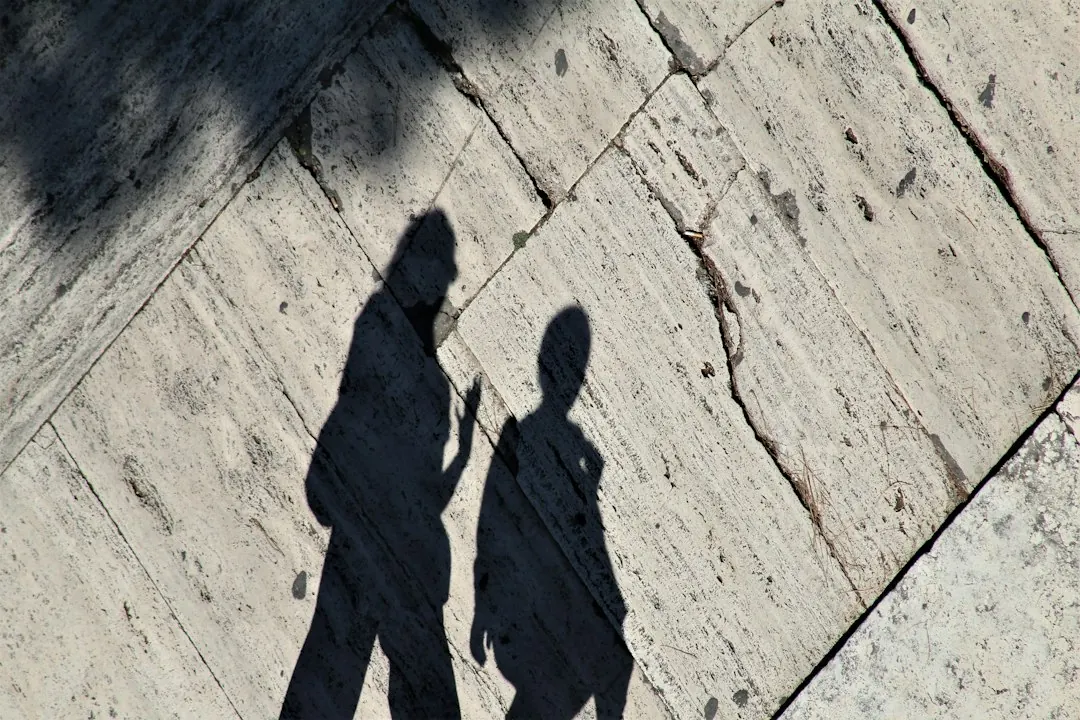 Two people walking together in step