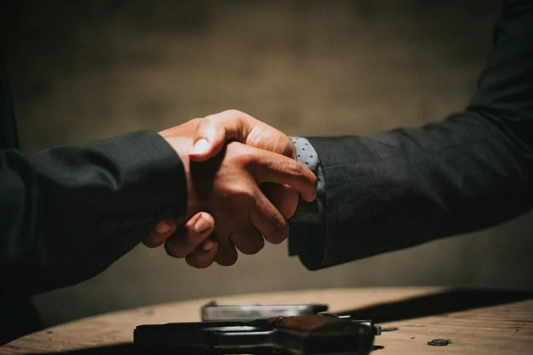A handshake, representing mutual agreement
