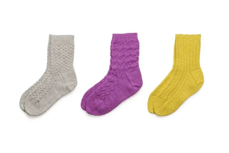 Matching pairs of colorful socks, representing compatible pairings