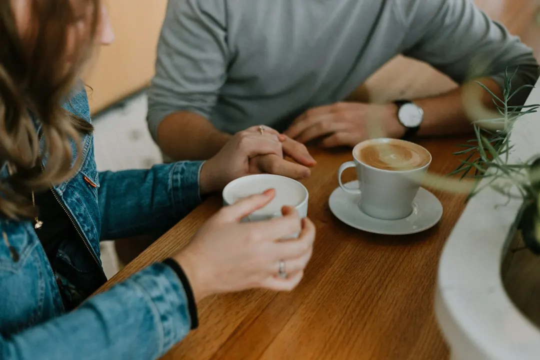 Two cups of coffee on a table, representing a calm conversation