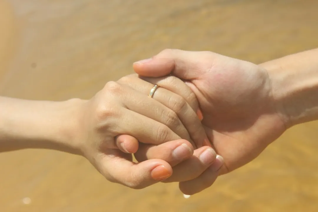 Holding hands in soft light