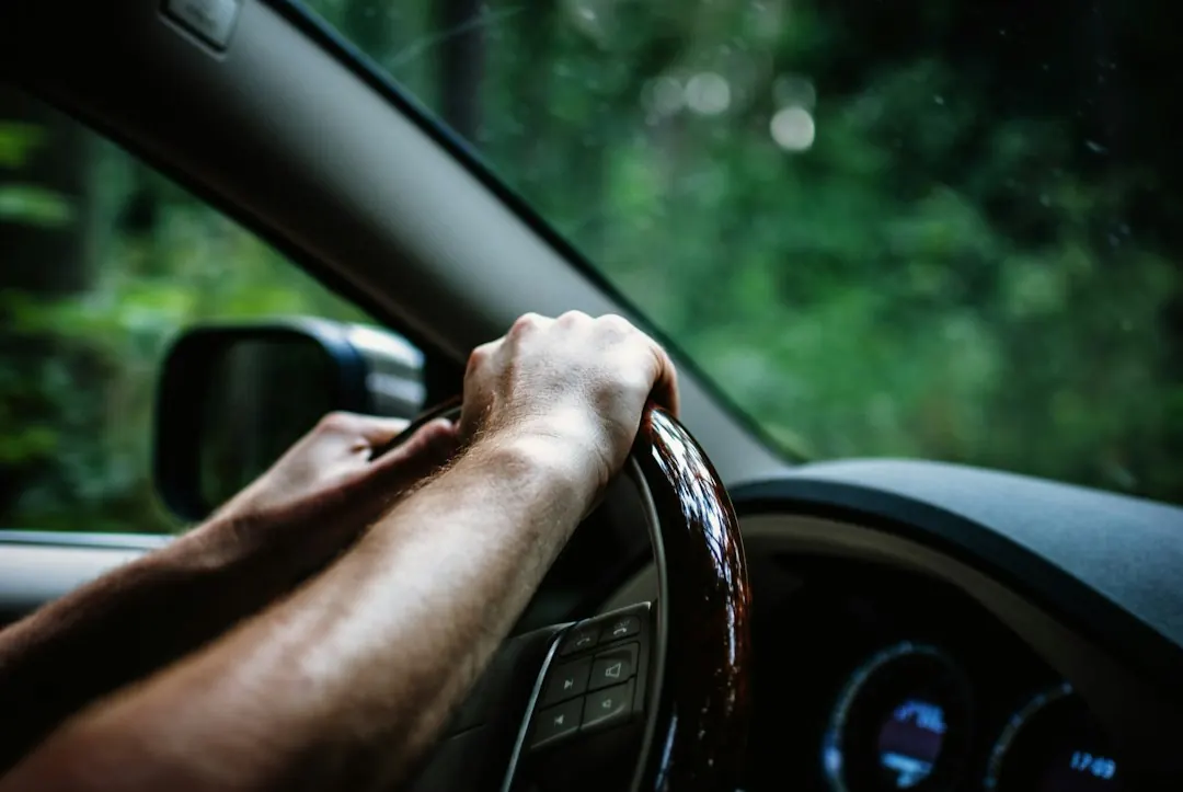 Hands on a steering wheel, representing taking the lead