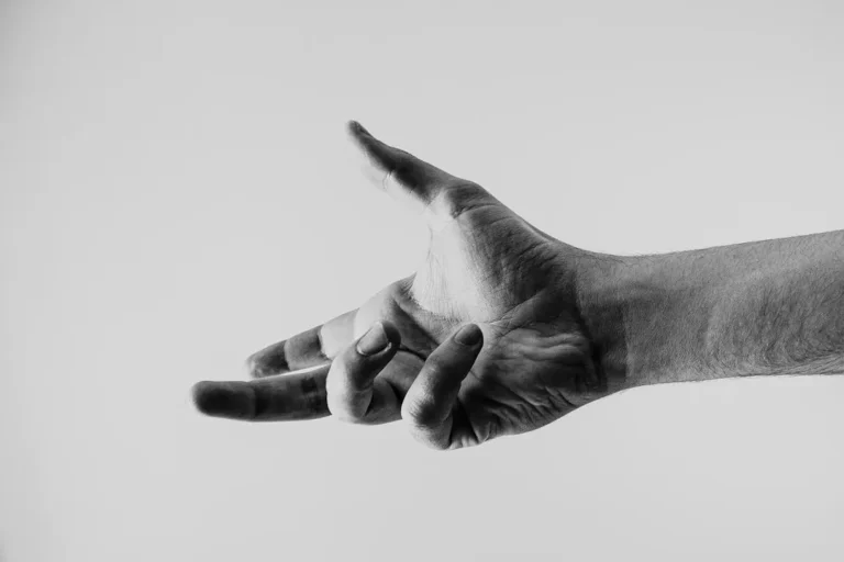 A hand gesture, representing a communication signal