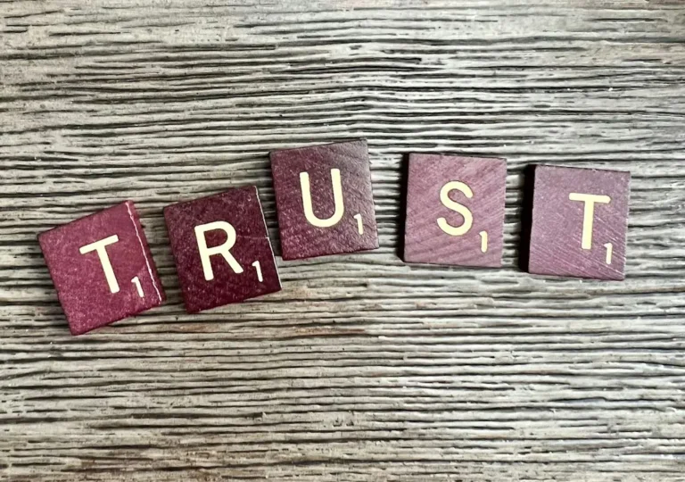A trust fall moment, representing the Submissive archetype's foundation of trust