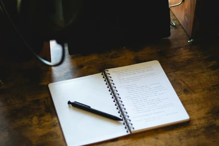 A person reading and reflecting on written notes